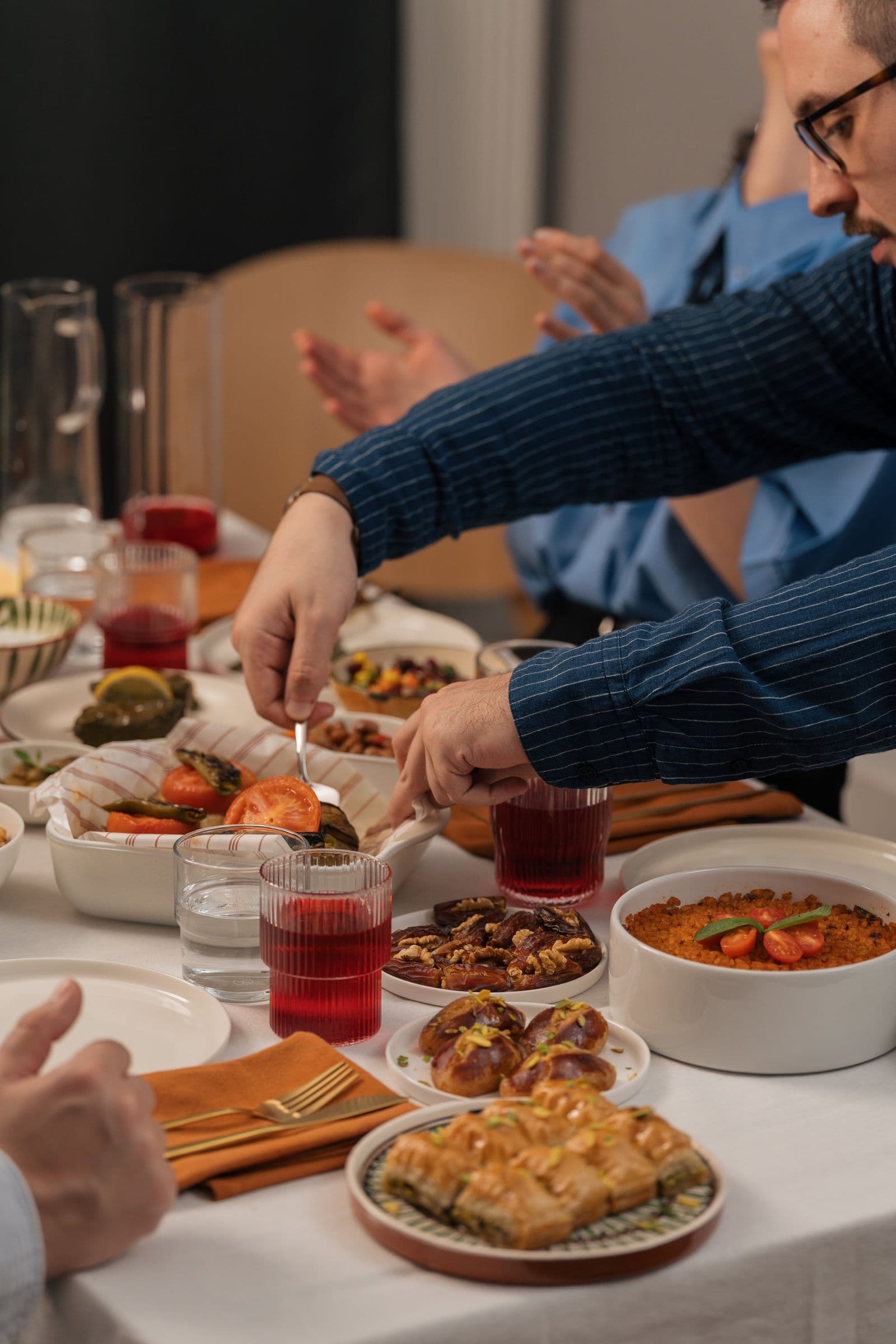 Family members sharing food and conversation around a dinner table